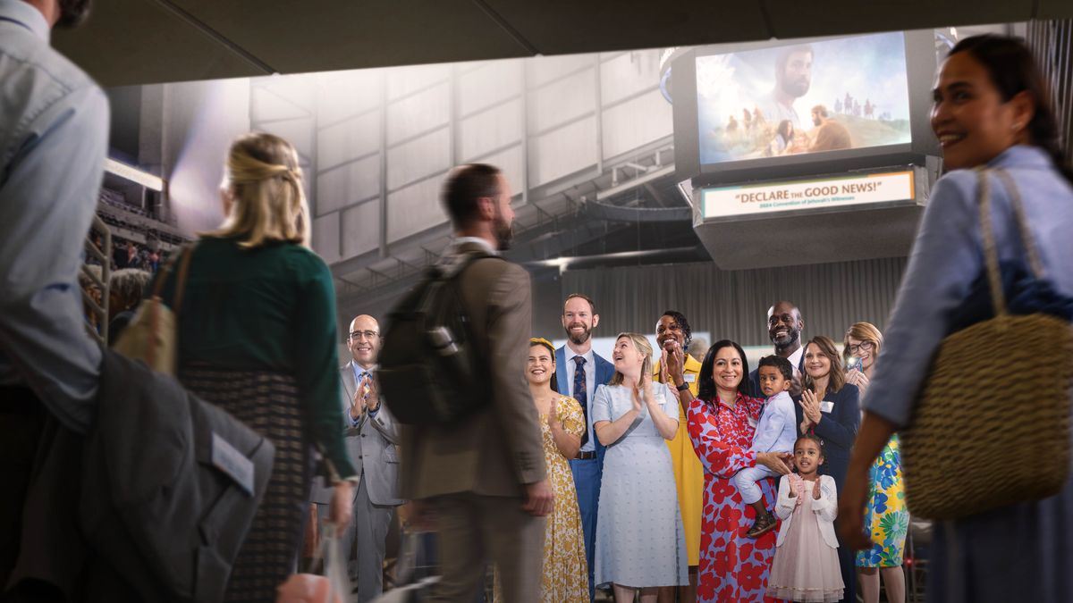 En grupp glada bröder och systrar på en sammankomst applåderar när några som precis blivit döpta går förbi.