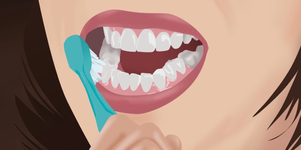 A woman brushing her teeth