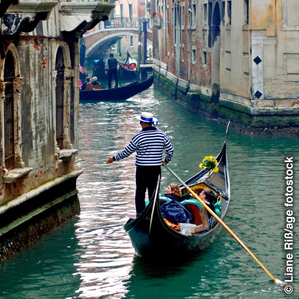 Tourists taking a gondola ride
