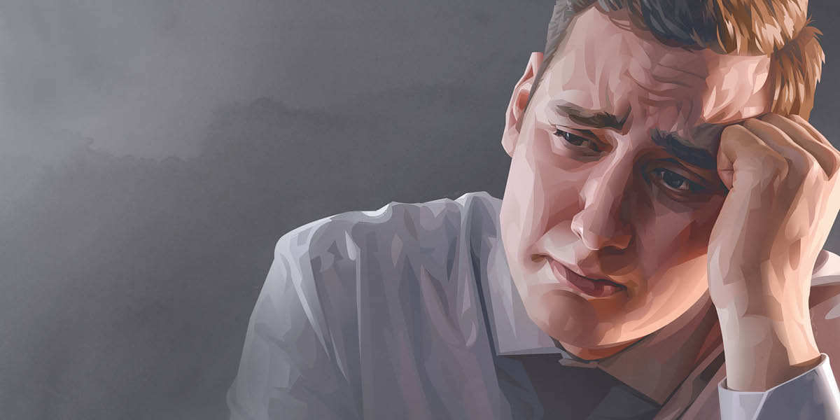 ผู้​ชาย​นั่ง​กุม​ขมับ