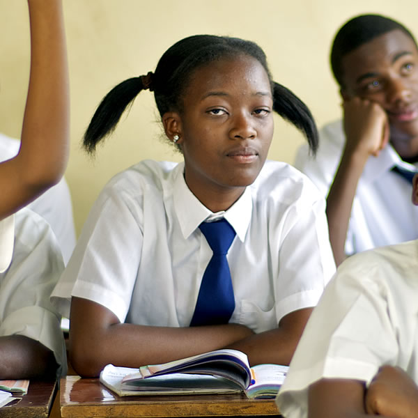 One girl in a classroom of boys