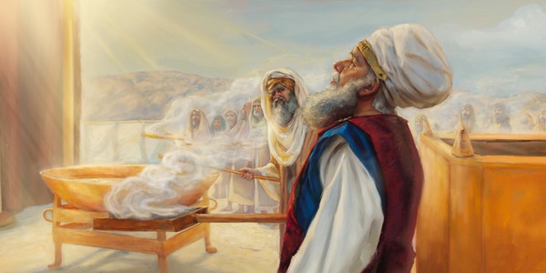 Het Pris Aron i holim plet bilong kukim paura i gat gutpela smel. Kora na lain bilong em i stap klostu na kukim paura olsem ofa