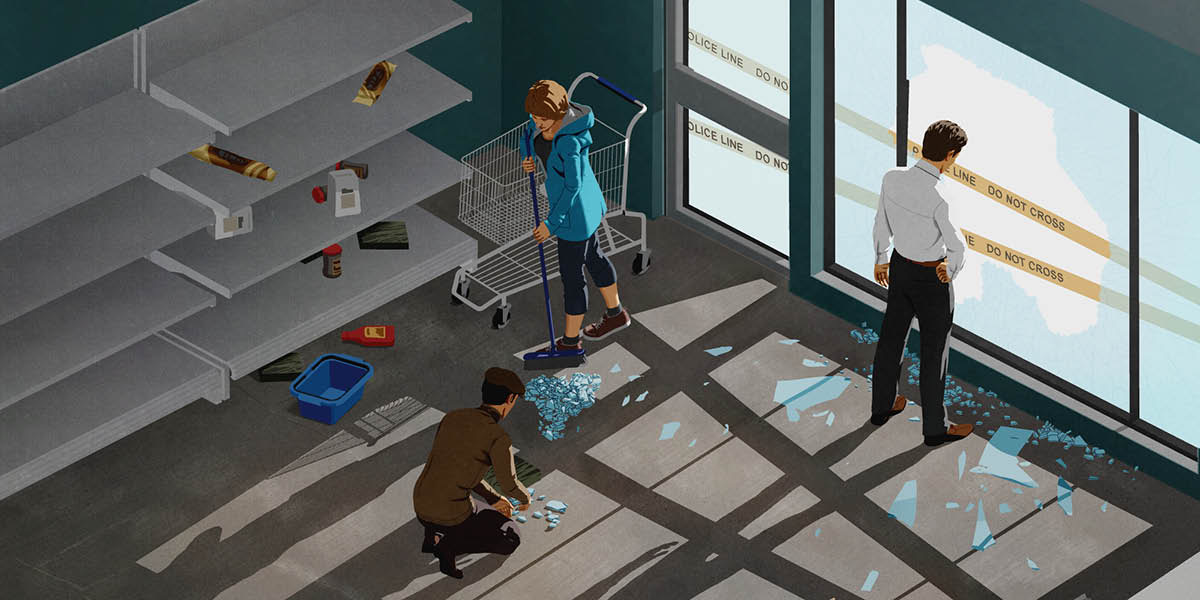 Власник розгромленого магазину дивиться у розбите вікно, а працівники прибирають уламки скла.