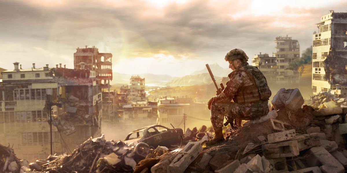 Một người lính đang trầm ngâm suy nghĩ khi ngồi giữa đống đổ nát của một thành phố bị chiến tranh phá hủy.