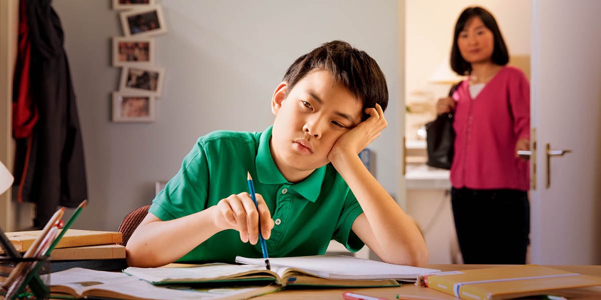 One boy de struggle to do e homework