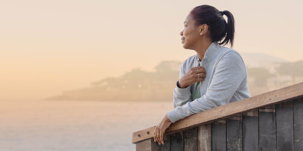 One woman dey sad as e fold e hand.