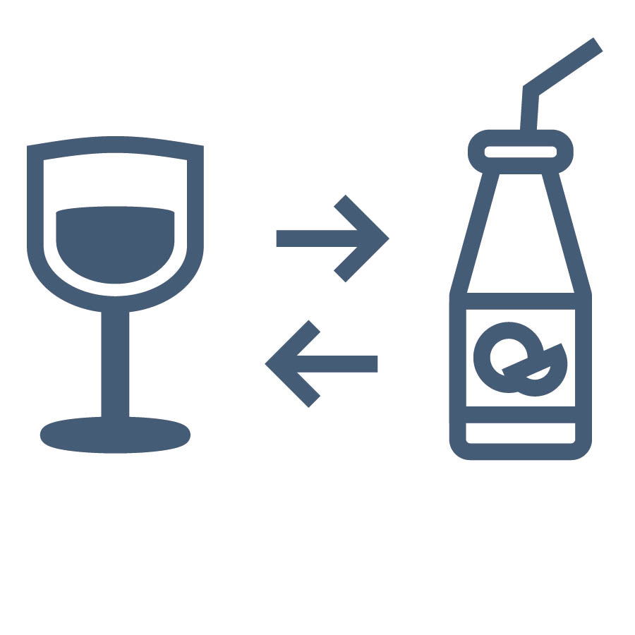 Glass cup wey wine dey inside dey near bottle of juice.