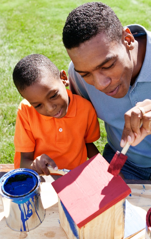 A father and son working on a project together