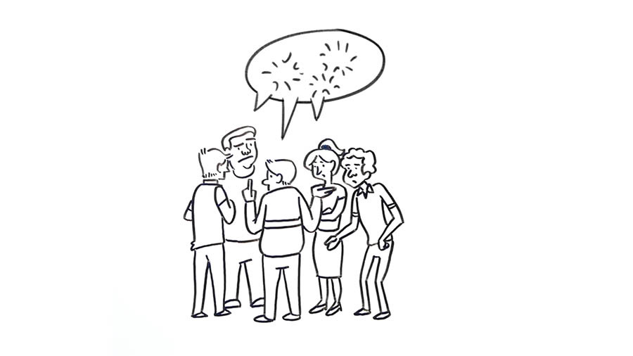 A group of people huddling together and gossiping.