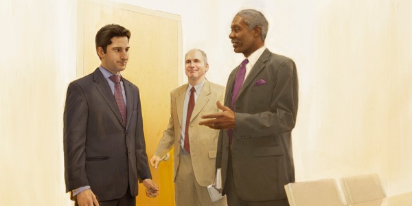 Two elders speak with a Christian brother in private